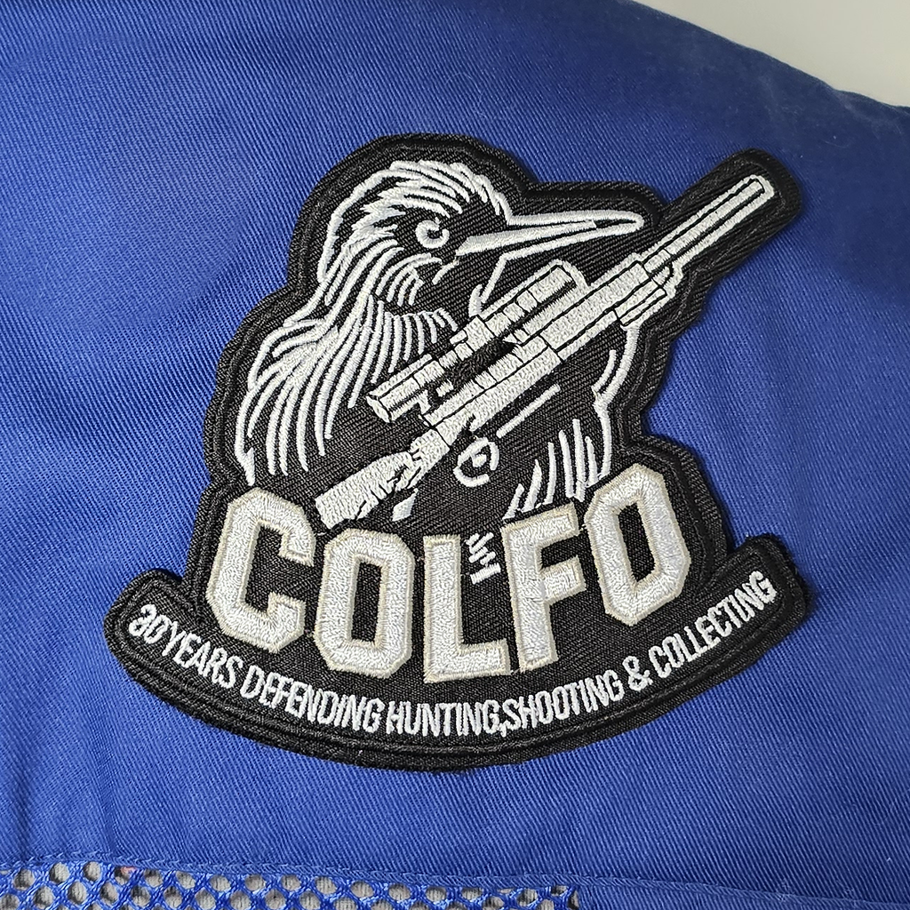 COLFO 30 Years patch on a blue shooting vest